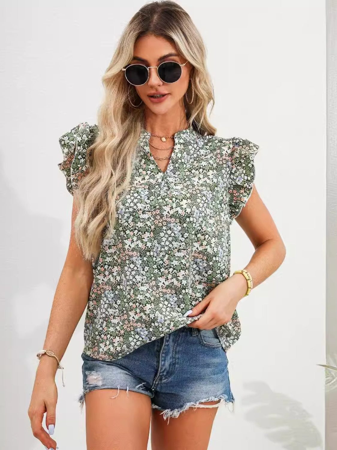 Zephariel Ruffled Floral Notched Cap Sleeve Blouse